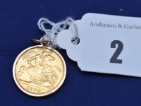 Lot 2 - A Victorian gold half sovereign, 1900, in 9ct....