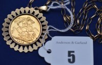 Lot 5 - A George V gold sovereign, 1919, in 9ct. gold...