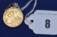 Lot 8 - A George V gold half sovereign, 1913, in 9ct....