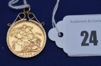 Lot 24 - A George V gold sovereign, 1913, in 9ct....