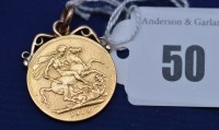 Lot 50 - A George V gold sovereign, 1913, with soldered...