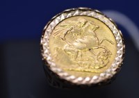 Lot 64 - A Victorian gold sovereign, 1892, in 9ct. gold...