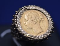 Lot 121 - A Victorian gold sovereign, 1881, in 9ct....