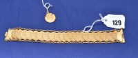 Lot 129 - A bracelet make up fo twenty-two George V...