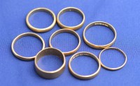 Lot 164 - Eight 22ct. yellow gold wedding bands, all...