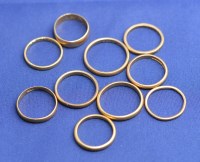 Lot 169 - ten 22ct. yellow gold wedding bands, all plain...