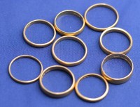 Lot 170 - Nine 22ct. yellow gold wedding bands, all...