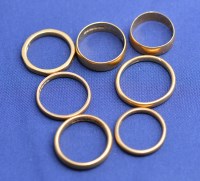 Lot 173 - Seven 22ct .yellow gold wedding bands, one...