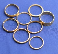 Lot 174 - Eight 22ct. yellow gold wedding bands, one...
