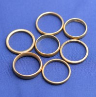 Lot 175 - Seven 22ct. yellow gold wedding bands, all...