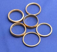 Lot 176 - Six 22ct. yellow gold wedding bands, all plain,...