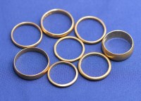 Lot 177 - Seven 22ct. yellow gold wedding bands, one...