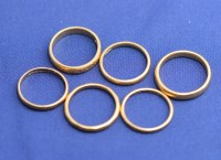 Lot 181 - Six 22ct. yellow gold wedding bands, one...