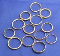 Lot 184 - Twelve 18ct. yellow gold wedding bands, of...