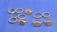 Lot 219 - Four yellow metal rings, stamped for 14ct....