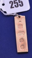 Lot 255 - A 9ct. yellow gold ingot pendant, 14.8grms.