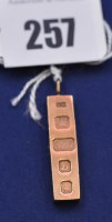 Lot 257 - A 9ct. yellow gold ingot pendant, 7.3grms.