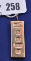 Lot 258 - A 9ct. yellow gold ingot pendant, 29.4grms.