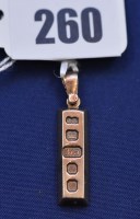 Lot 260 - A 9ct. yellow gold ingot pendant, 4.7grms.