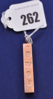 Lot 262 - A 9ct. yellow gold ingot pendant, 23.7grms.