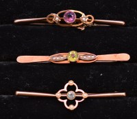 Lot 291 - Three Edwardian bar brooches, one set amethyst...