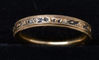 Lot 295 - A black enamel yellow metal mourning ring,...