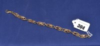 Lot 304 - A 9ct. yellow gold bracelet, of twisted oval...
