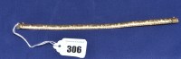 Lot 306 - A 9ct. yellow gold bracelet of textured links,...