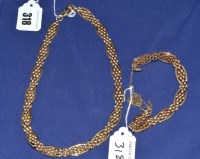 Lot 318 - A 9ct. yellow gold necklace and matching...