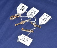 Lot 323 - Four cultured pearl set 9ct. yellow gold...