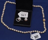 Lot 327 - A cultured pearl single row necklace on 9ct....