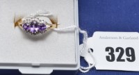 Lot 329 - An amethyst and diamond ring, the three...
