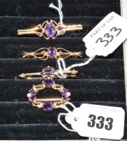 Lot 333 - Five amethyst brooches, two of circlet design,...