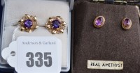 Lot 335 - A pair of emerald and 9ct. yellow gold stud...
