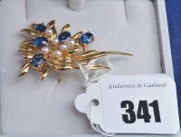 Lot 341 - A sapphire and cultured pearl 9ct. yellow gold...