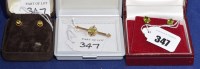 Lot 347 - Two pairs of peridot stud earring in 9ct. gold...