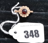 Lot 348 - A garnet and cultured pearl cluster ring on...