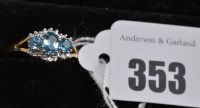Lot 353 - A blue topaz and diamond ring, the three facet-...