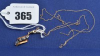 Lot 365 - A sapphire and diamond set pendant on fine...