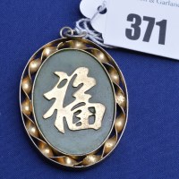Lot 371 - A jade coloured stone and yellow metal Chinese...