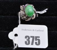 Lot 375 - A jade coloured stone ring, the illusion-cut...
