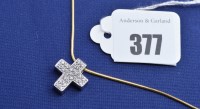 Lot 377 - A diamond cross pattern pendant in 14ct. white...