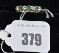 Lot 379 - An emerald and diamond ring, the three...
