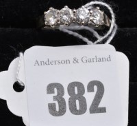Lot 382 - A four stone diamond ring, the brilliant-cut...