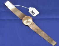 Lot 383 - A 9ct. yellow gold Tissot wristwatch, the...