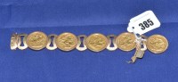 Lot 385 - A gold sovereign set 9ct. yellow gold bracelet,...