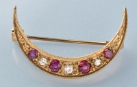 Lot 388 - A ruby and diamond crescent form brooch, in...