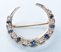 Lot 389 - A sapphire and diamond crescent brooch, the...