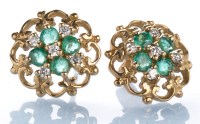 Lot 394 - A pair of emerald, diamond and 9ct. yellow...