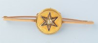 Lot 400 - A diamond, enamel and yellow metal bar brooch,...